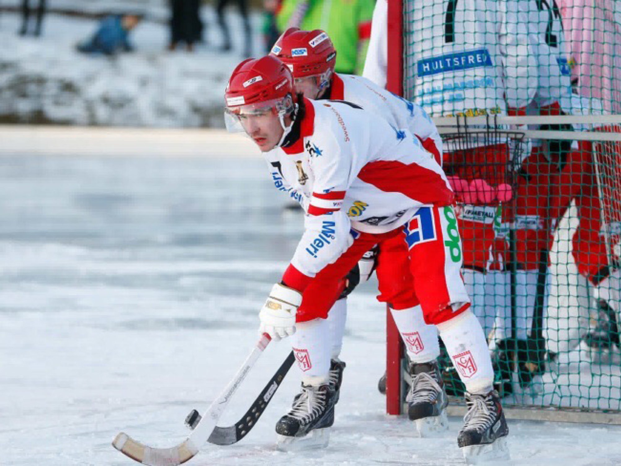 Two bandy players on ice